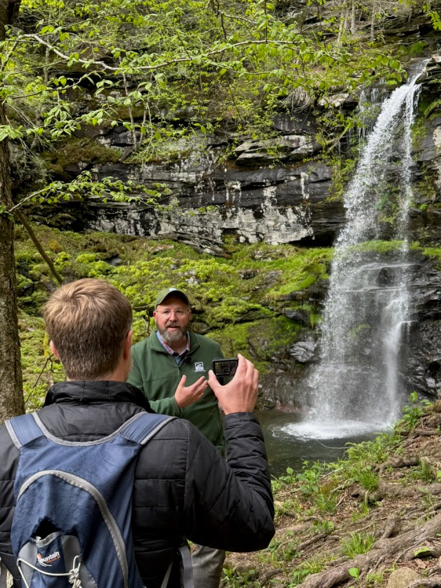 Jeff Senterman being filmed at Platte Clove in front of Plattekill Falls.